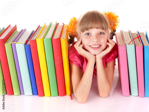 Photo: Child with pile of books. Child with pile of books.