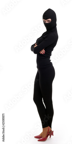 Photo: female thief in balaclava with crossed arms female thief in balaclava with crossed arms