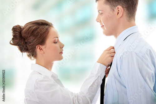 Photo: Knotting the necktie Knotting the necktie