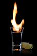 Flaming vodca, and lime over black Flaming vodca, and lime over black