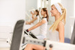 Two beautiful sportwomen make exercise Two beautiful sportwomen make exercise