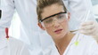 young female chemist with a probe