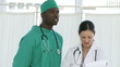 Afro surgeon with a nurse
