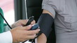Doctor checking the blood pressure of a patient