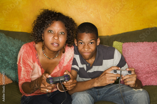 Photo: African-American family playing video game African-American family playing video game