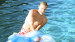 Father and son playing  in a swimming pool