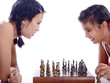 sisters playing chess isolated on white background