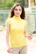 Young woman in yellow