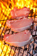 Three pork chops on the BBQ