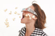 Young woman with 3D glasses and popcorn in the air Young woman with 3D glasses and popcorn in the air