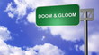 signpost on the road annoucing the doom & gloom road