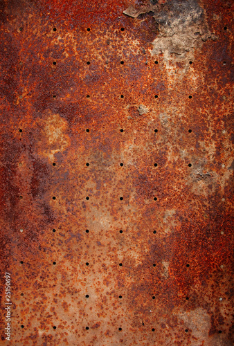 Foto: old metal texture with round holes old metal texture with round holes