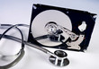 Computer hard drive and a stethoscope. Computer hard drive and a stethoscope.