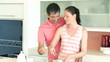 happy couple baking together