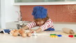 young boy baking alone in the kitchen