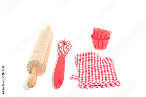 Photo: two cake molds with kitchen baking utensils isolated over white two cake molds with kitchen baking utensils isolated over white