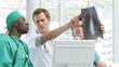 handsome doctors looking at an x-ray
