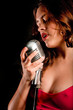 Beautiful singer singing with microphone