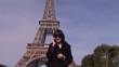 Video: Attractive woman on the phone in front of the Eiffel tower Attractive woman on the phone in front of the Eiffel tower