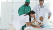 clinic personal with a baby in a room