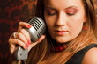 woman hugged hand vintage microphone placed on stand