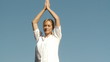 peaceful woman doing yoga outside