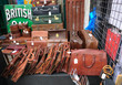 Old leather travel bags / briefcases on a street market stall.