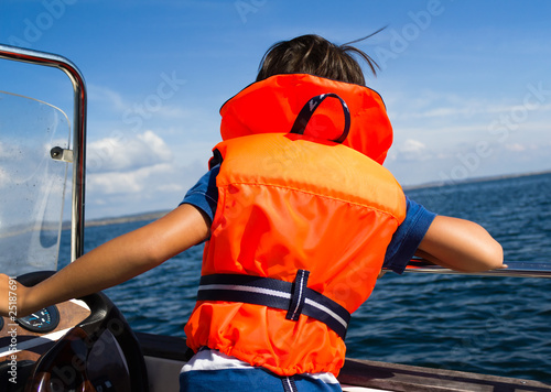 Photo: Child with life vest Child with life vest