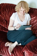 Woman browsing a touchscreen tablet