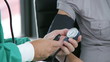 doctor checking the blood pressure of a patient