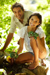 Happy young couple gardening outdoors smiling
