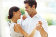 Young romantic couple dancing together - Outdoors