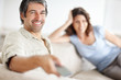 Mature couple relaxing at home and watching tv