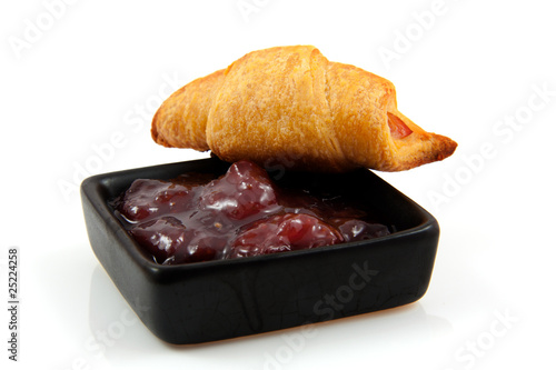 Photo: croissant and marmalade over white background croissant and marmalade over white background