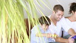 parents playing video games with their son at home