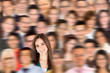 Woman standing out from a crowd