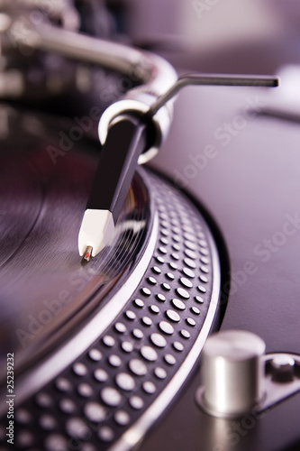 Photo: Turntable playing the vinyl record Turntable playing the vinyl record