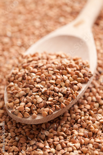 Photo: buckwheat in wooden spoon buckwheat in wooden spoon