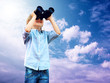 Young boy watch in the field-glass, outdoors.