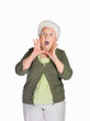 Surprise mature woman isolated against white background
