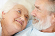 Beautiful mature woman looking at loving senior man