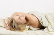 Sensual woman lying in bed