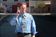 Pleased, good-looking guy talks on cell phone.