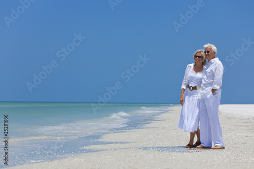Photo: Happy Senior Couple Looking To Sea on A Tropical Beach Happy Senior Couple Looking To Sea on A Tropical Beach