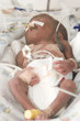 Newborn baby inside incubator
