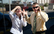 Couple shows displeasure with conversation.