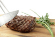 roasted meat on a cutting board. isolated object