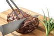 roasted meat on a cutting board. isolated object roasted meat on a cutting board. isolated object