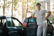 Man standing near a car