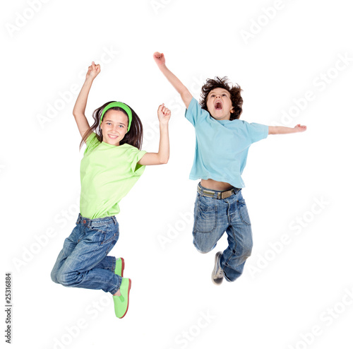 Photo : Two happy children jumping at once Two happy children jumping at once